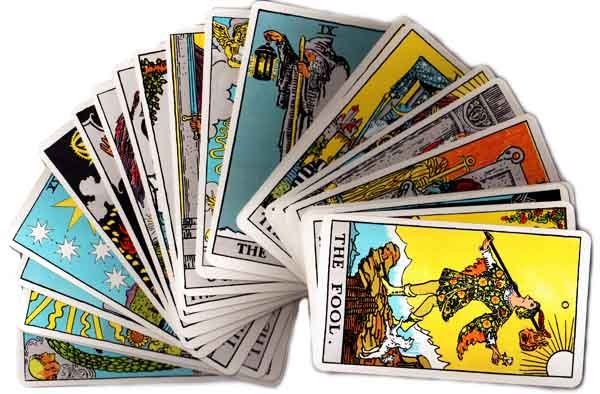 Hands on the tarot cards